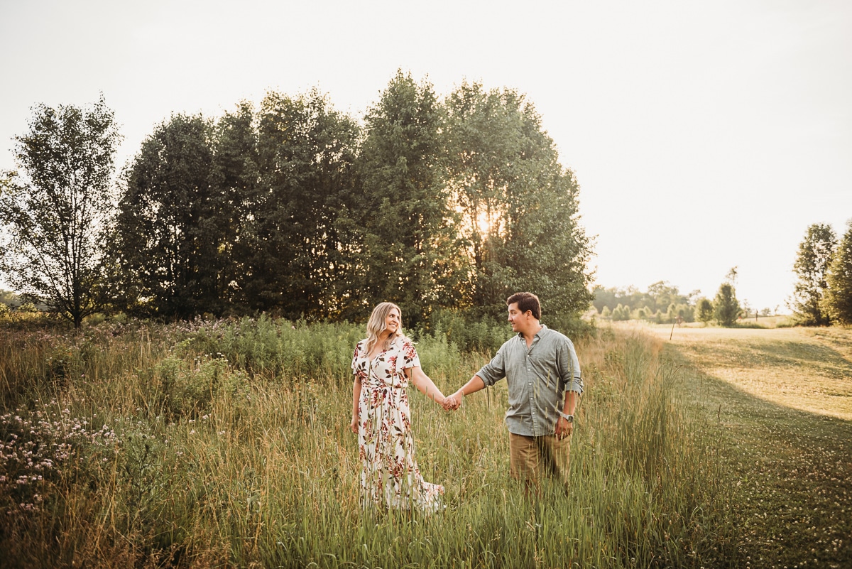 State College Engaged Couple in Field at Sunset